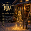 Christmas bell decoration solar yard light with glowing cascade in a garden