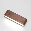 Rotatable wood wall light in a bedroom