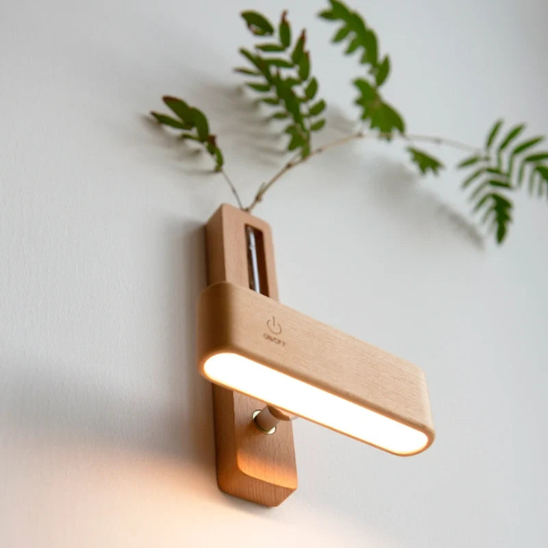Wood vase wall light used as a handheld