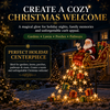Solar Christmas lights Santa sleigh yard stake glowing in a garden at night