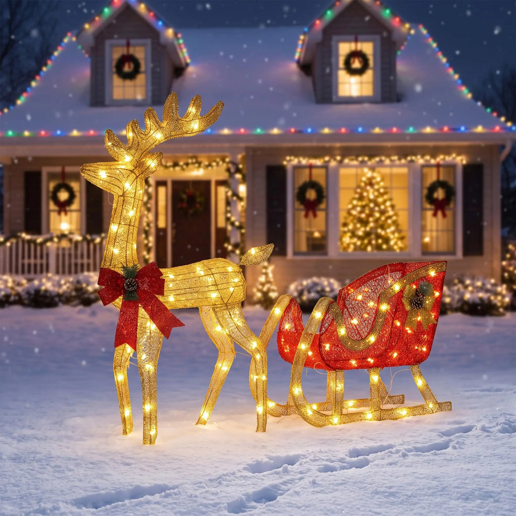 Lighted reindeer and sleigh outdoor Christmas decoration on a front lawn