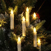 Christmas tree candle lights clipped on branches glowing warm white