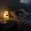 Ghost night light lamp on a bedside table
