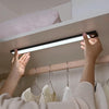 Motion sensor light bar lighting a closet