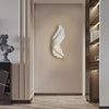 LED wall art feather wall light, in a hallway