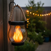 Solar flame effect lantern hanging outdoors