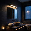 Rotatable LED vanity light bar in sand black lit at warm 3000K in a slate bathroom