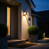 Black slatted column pillar light on a masonry entrance column at blue hour