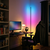 RGB corner floor lamp washing a game room corner in a blue to magenta gradient