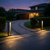 Two 31.5 inch bollard lights at a driveway entrance at dusk