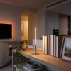 Silver cordless LED table lamp styled on a living room shelf