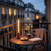 Orange rechargeable table lamp on a balcony bistro table at dusk