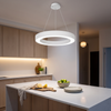 White LED ring pendant light glowing over a kitchen island, 19.7 inch circle