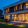 Modern facade with up down wall lights at blue hour
