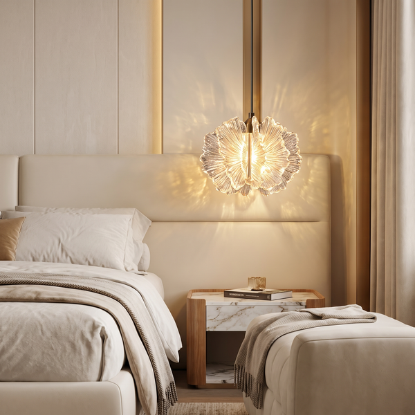 Crystal petal pendant light sparkling beside an upholstered bed