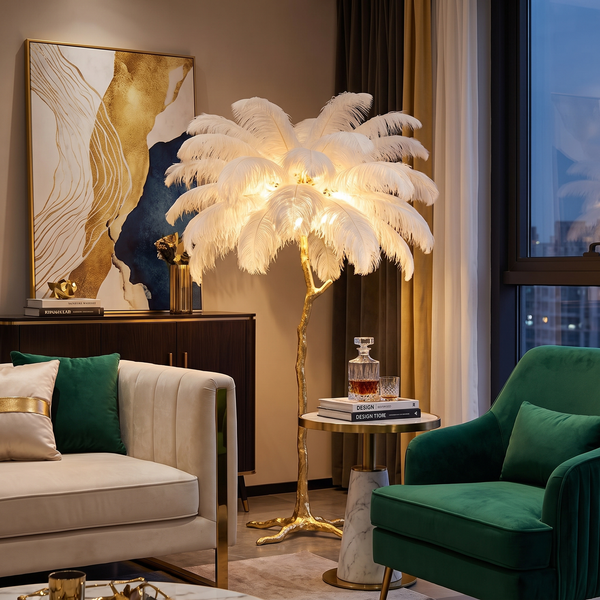 White feather palm floor lamp with gold branch base in a luxe living room