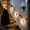 Ribbed glass dome wall lights along a stairwell
