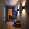 Row of adjustable cube wall lights in a hallway
