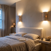 Pair of natural stone wall sconces beside a bed