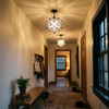 Two Moravian star lights along a hallway