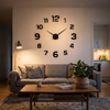 Frameless DIY wall clock above a living room sofa