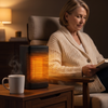 Oscillating space heater glowing on a side table next to a reading chair