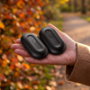 Black magnetic rechargeable hand warmers in one palm