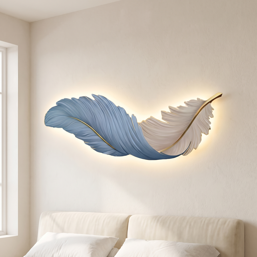 LED wall art feather wall light, blue and white, hung horizontally above a bed