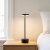 Cordless desk lamp, black aluminum rechargeable lamp on a nightstand