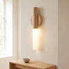 Wood wall sconce with motion sensor, rechargeable, light brown, in a hallway