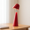 Cordless table lamp, rechargeable cone lamp, red, on a desk
