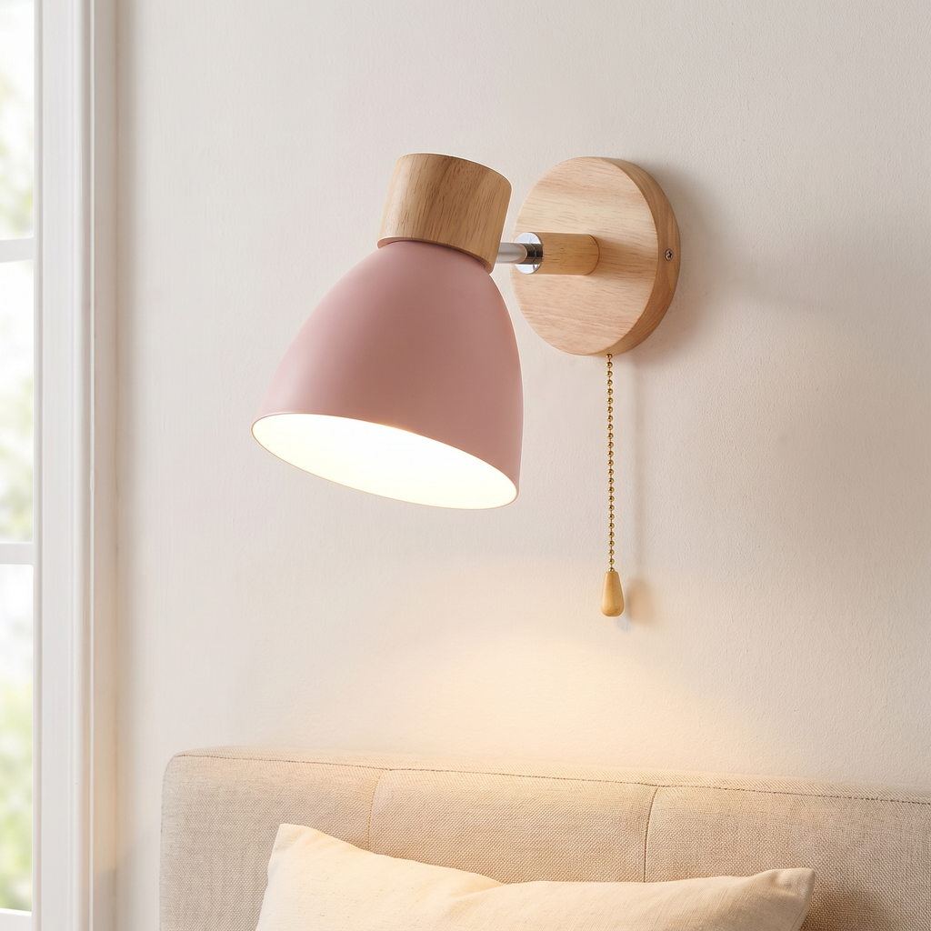 Pull chain wall sconce, pink, Scandinavian wall light beside a bed