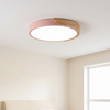 Modern flush mount ceiling light, round LED, pink rim, wood accent