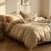 Floral duvet cover set on an unmade bed, Light Cream