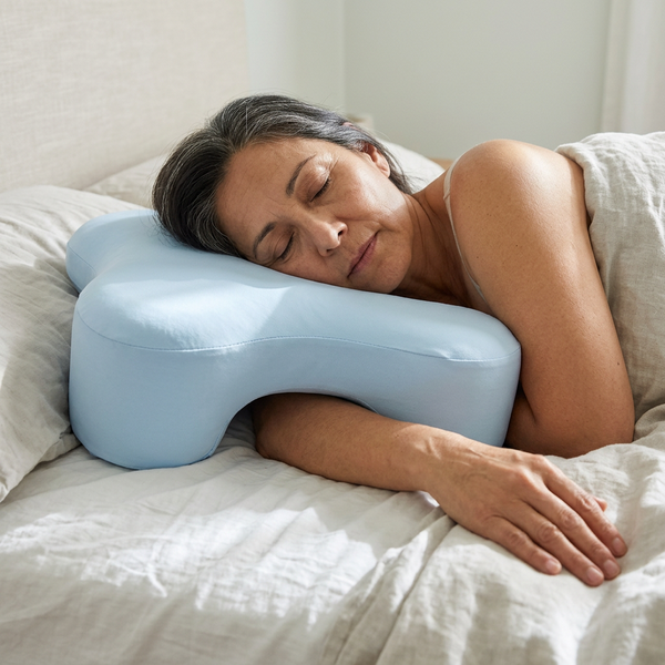 Side sleeper pillow with arm hole in use, Sky Blue