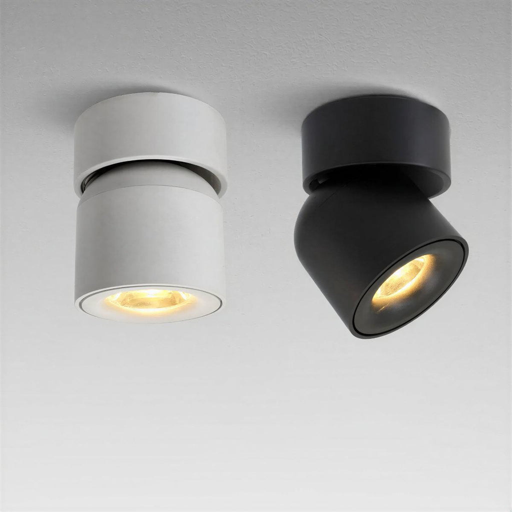White adjustable ceiling spotlight on a painted ceiling