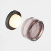 Compact dimple sconce scale reference on a wall