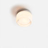 White dimpled wall sconce with soft ambient glow