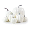 Seven white foam pumpkins in graduated sizes with silver stems