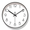 Nordic wall clock with white face and abstract markers