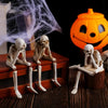 Skeleton shelf sitter styled with books and candles