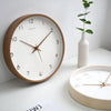 Wooden wall clock styled in a modern living room