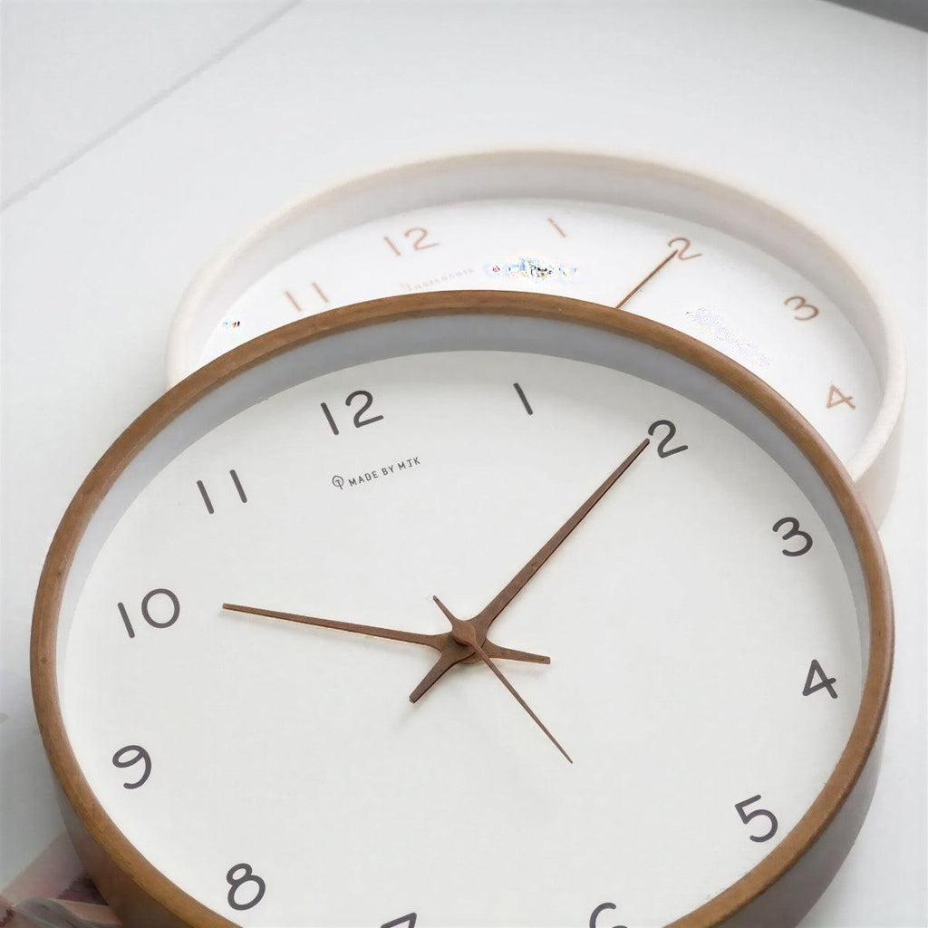 Solid wood wall clock detail showing grain and numerals