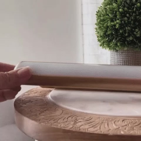 Gold cordless picture light close-up and remote dimming over a shelf
