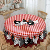 Round red plaid rooster tablecloth on a round dining table