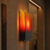 Sunset wall light above a bed